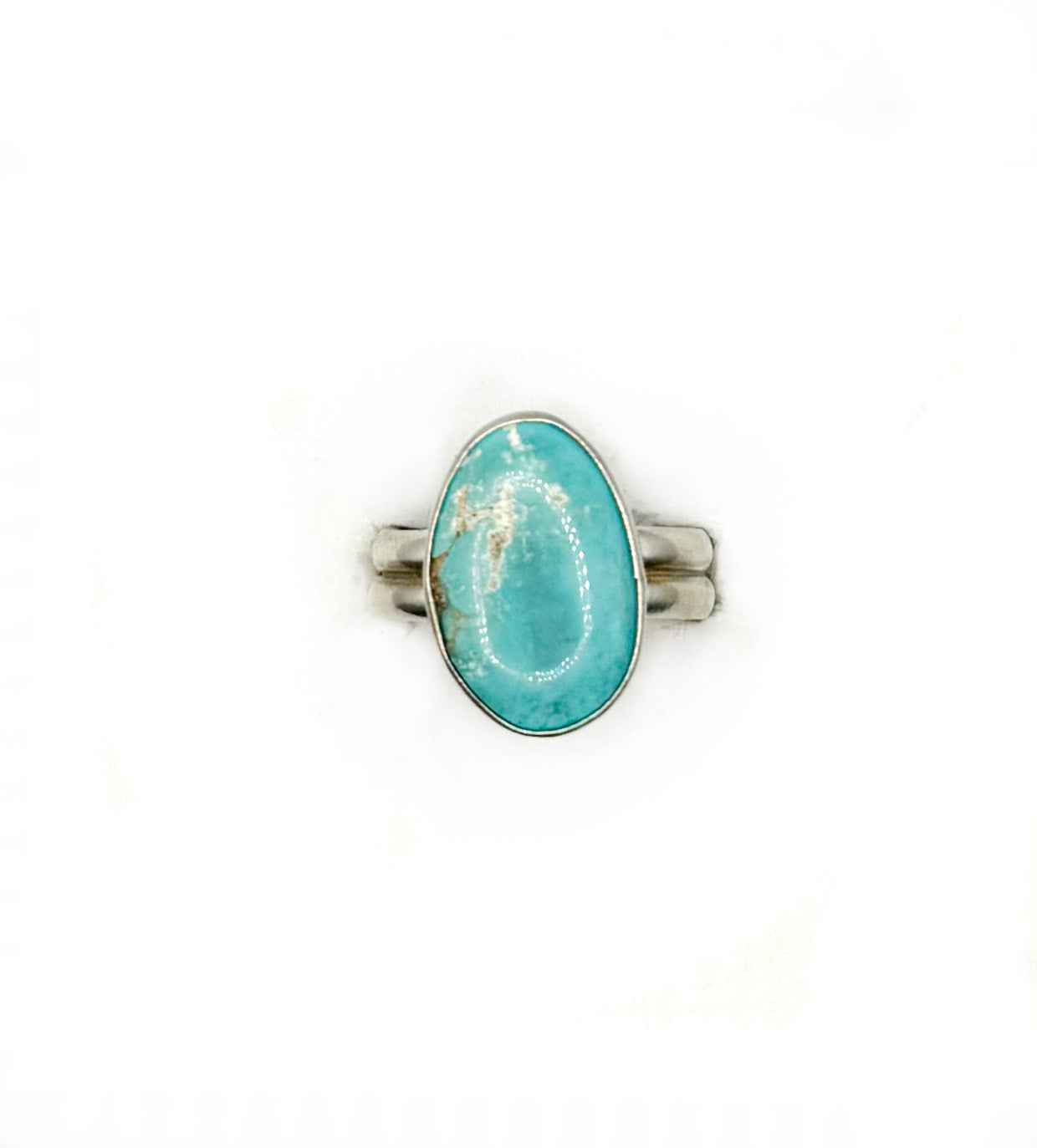 Ring with a turquoise stone on a white background
