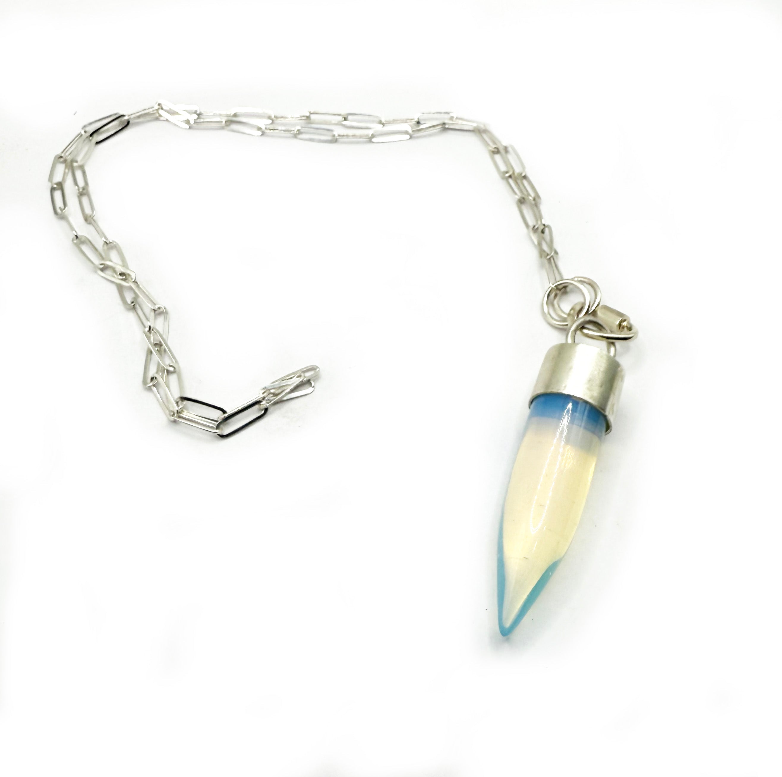Necklace with a silver chain and a unique pendant on a white background